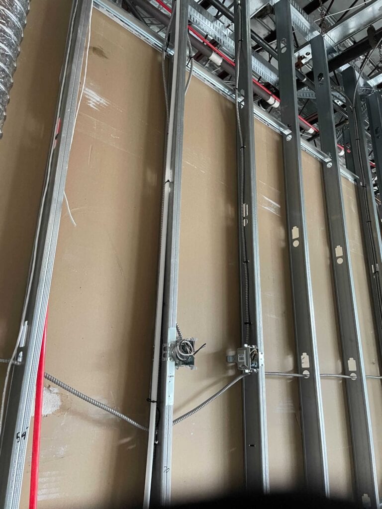 Steel stud walls with electrical conduit rough-in during a commercial renovation