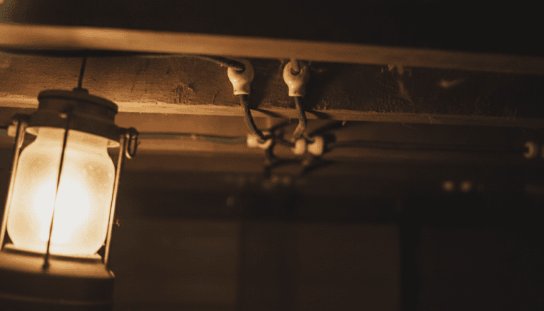 Knob and tube wiring with porcelain knobs along basement joists in an Ontario century home